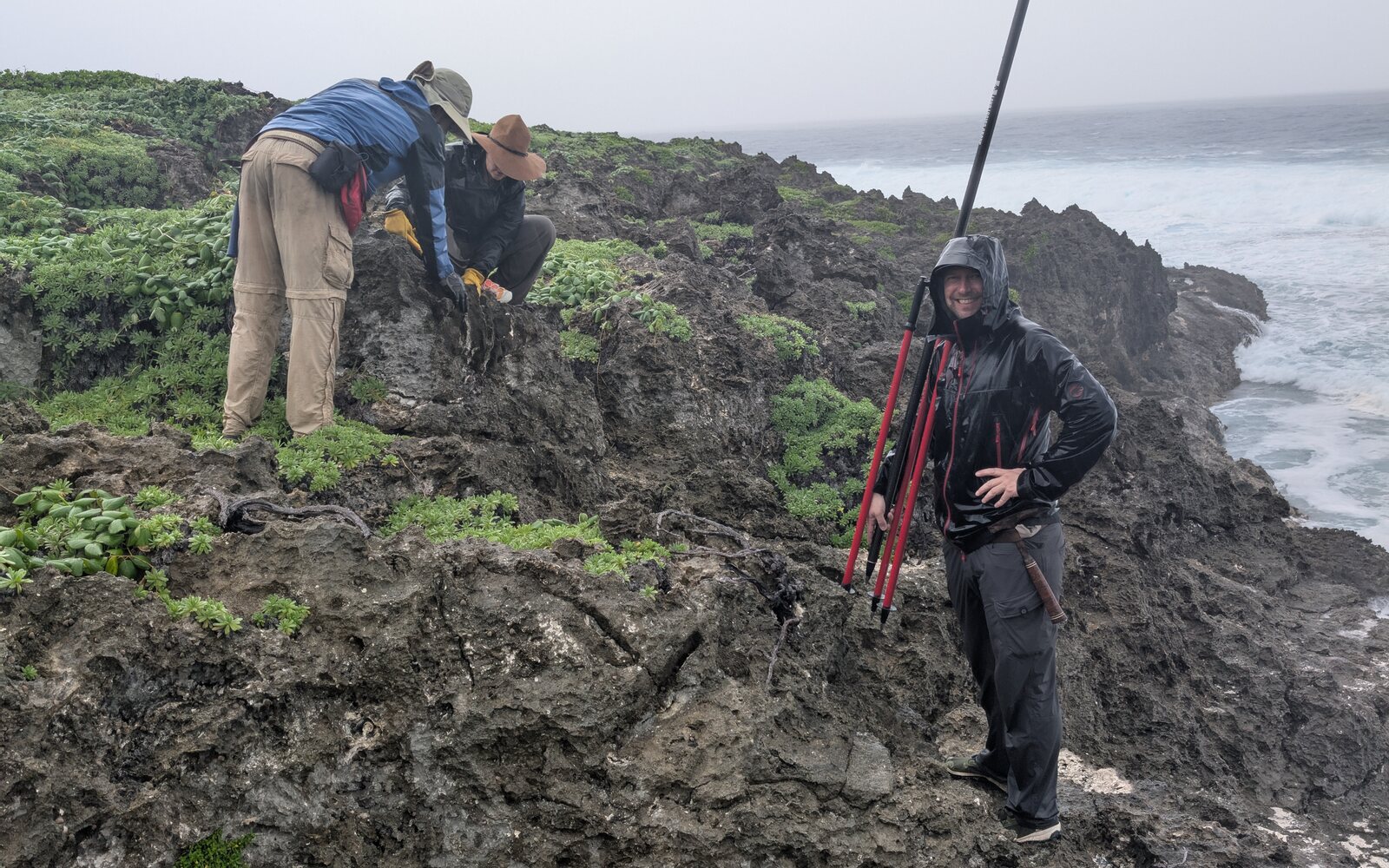 HISEAS field team surveying makatea along a Southern Cook Islands coastline.